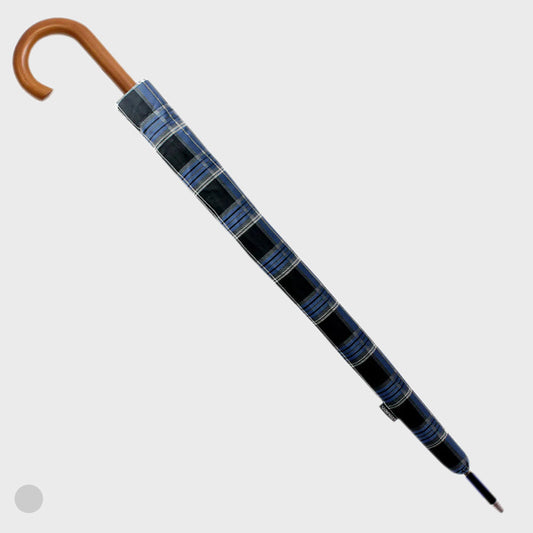 Blue and black checkered umbrella with wooden handle on a light gray background